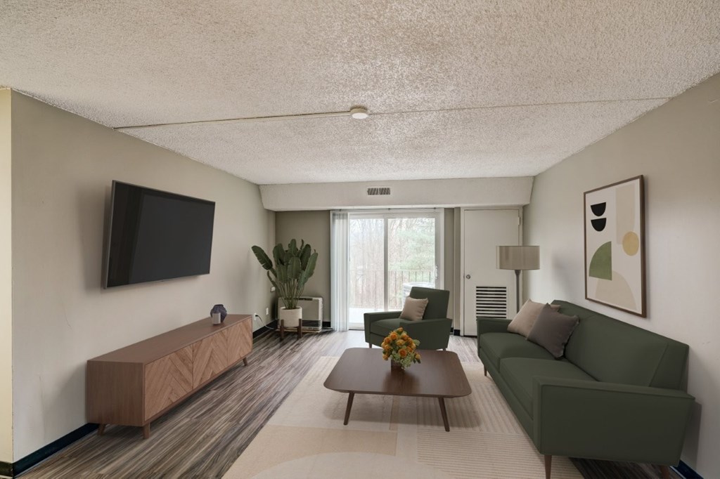 a living room with a green couch and a coffee table