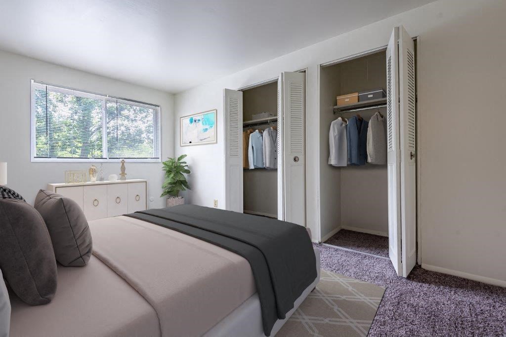 a bedroom with a bed and a closet