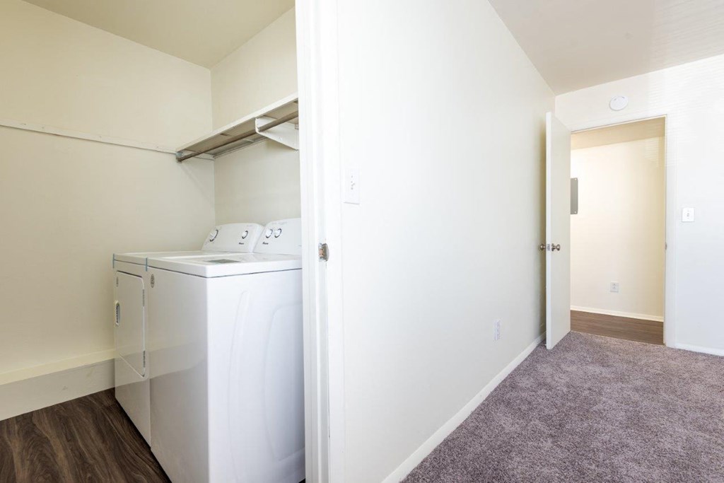 a laundry room with a washer and dryer in it