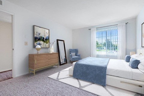 a bedroom with a bed and a dresser and a window