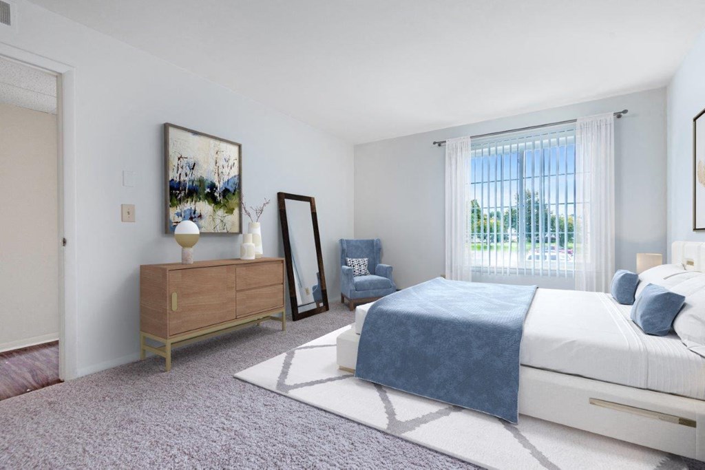 a bedroom with a bed and a dresser and a window