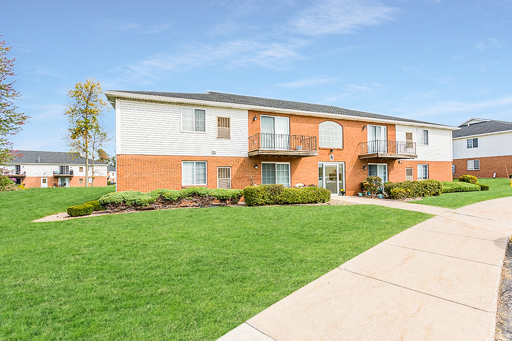 a brick and with a lawn and a sidewalk