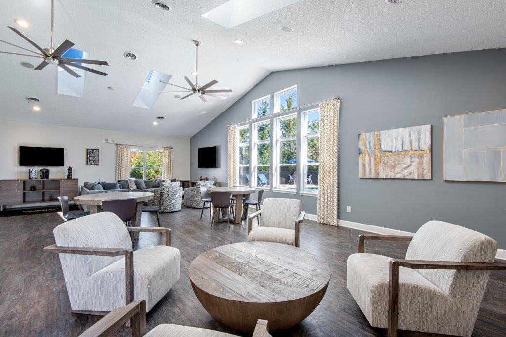 a living room with couches and chairs and a table