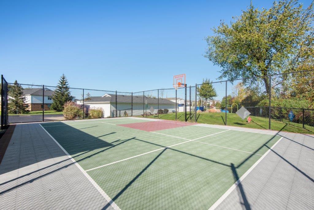 the tennis court is equipped with a basketball court