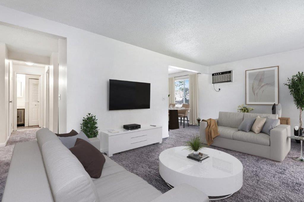 Staged living room with carpet throughout