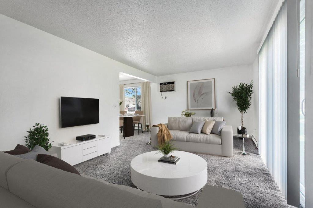 Staged living room with carpet throughout