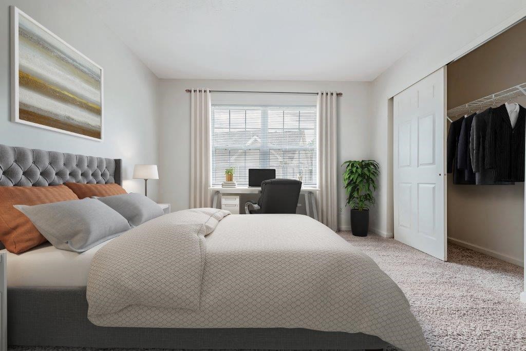 a bedroom with a bed and a closet