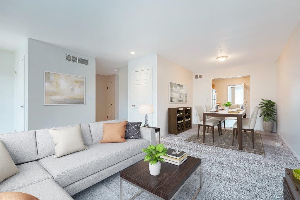 a living room with a couch and a table