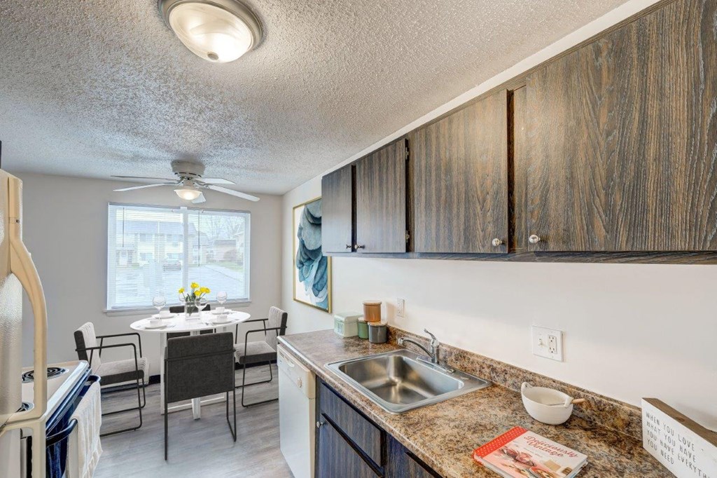 our apartments have a kitchen and dining room with a table