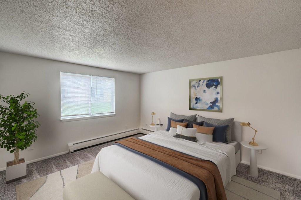 a bedroom with a bed and a window