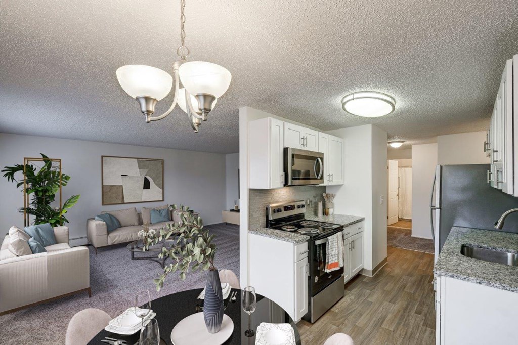 an open kitchen and living room with a dining room and a living room