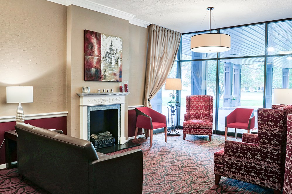 a living room filled with furniture and a fire place