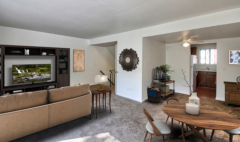 staged living room with wall to wall carpet