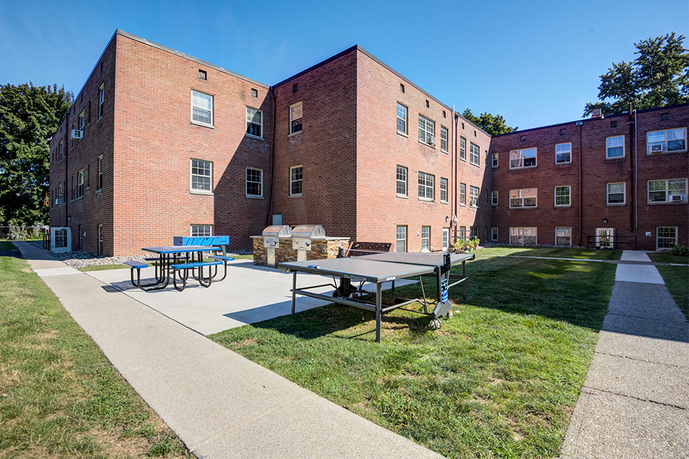exterior area with grilling stations and outdoor ping pong
