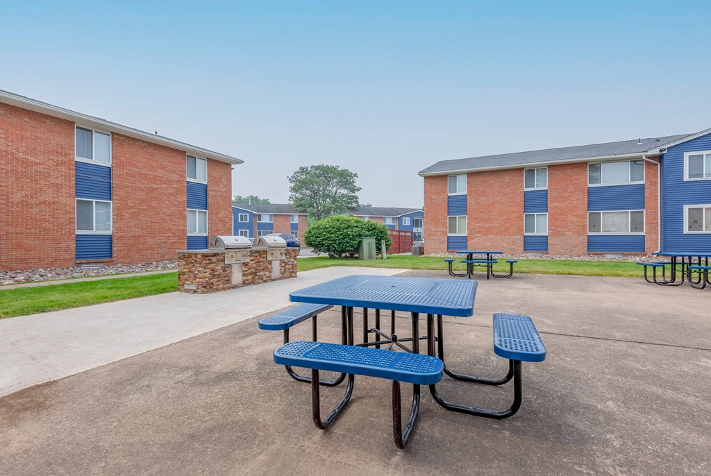 our picnic tables are in front of our building with our apartments in the background