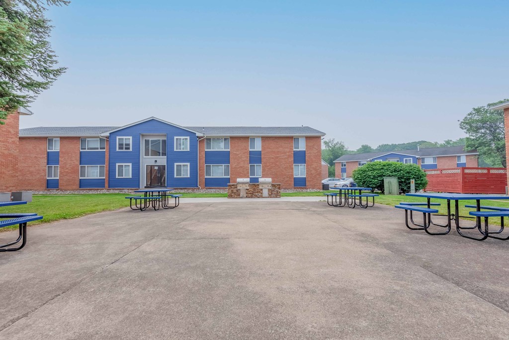 our apartments feature an open courtyard with picnic tables