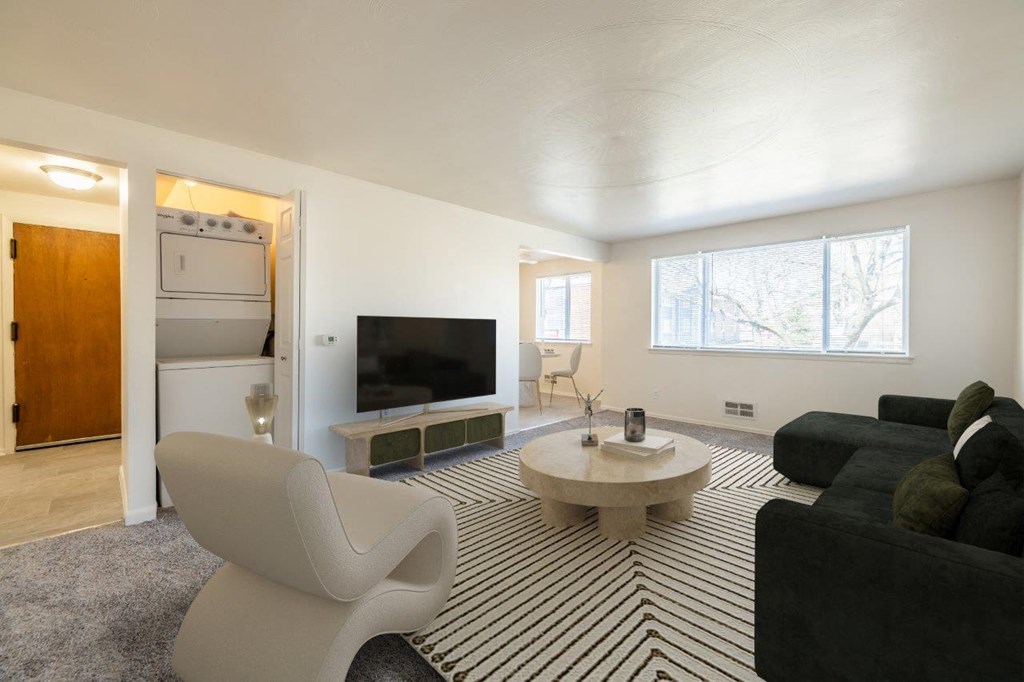 a living room with a couch and a table and a television