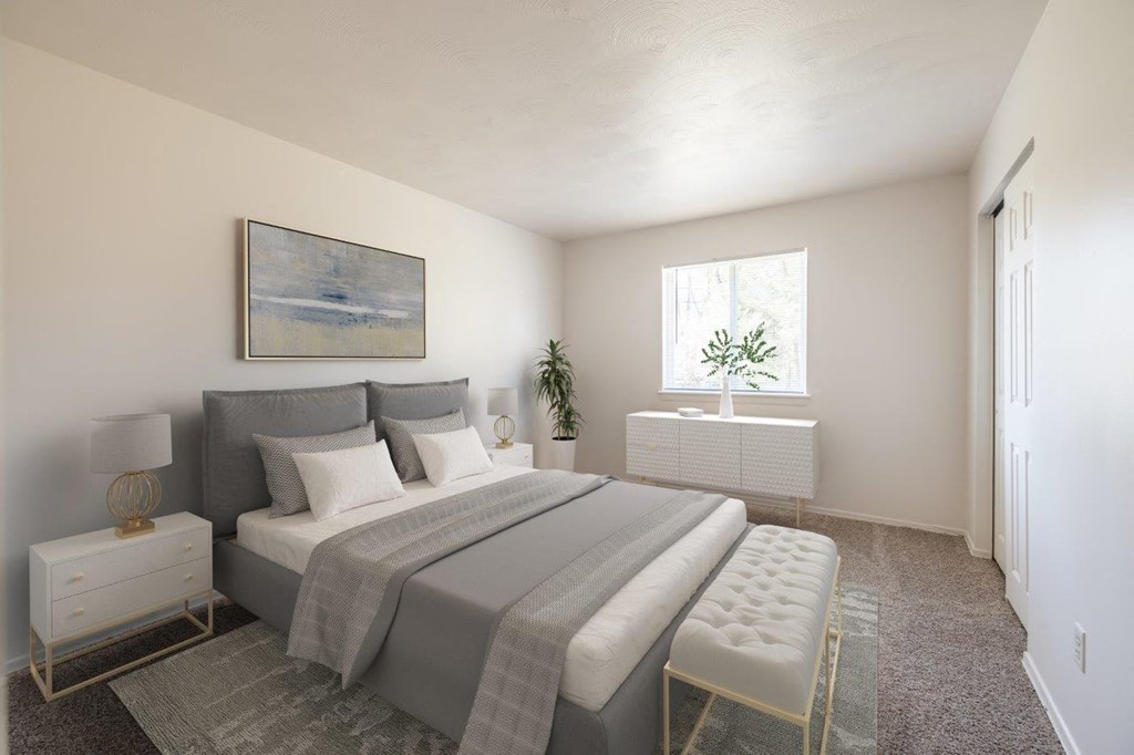 a bedroom with a bed and a window