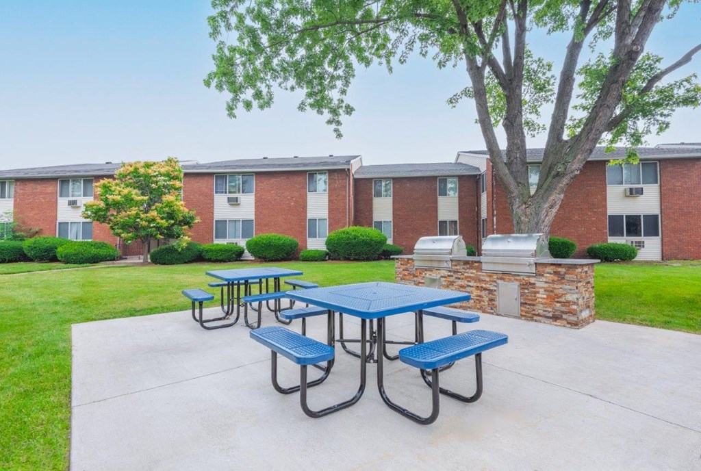 our picnic area is in front of our building with benches and tables