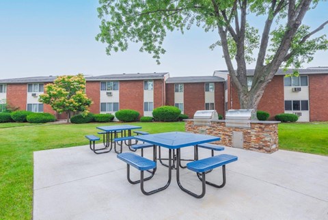 our picnic area is in front of our building with benches and tables