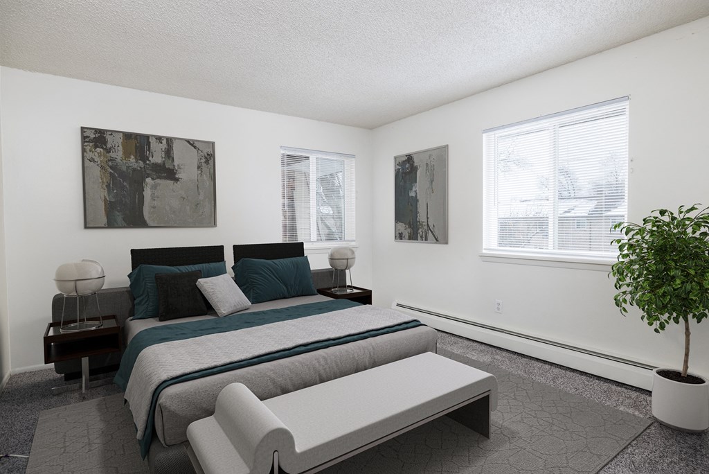 a bedroom with a bed and a couch