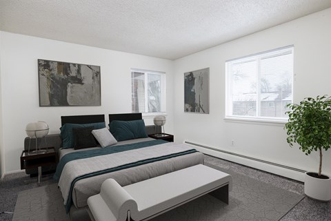a bedroom with a bed and a couch