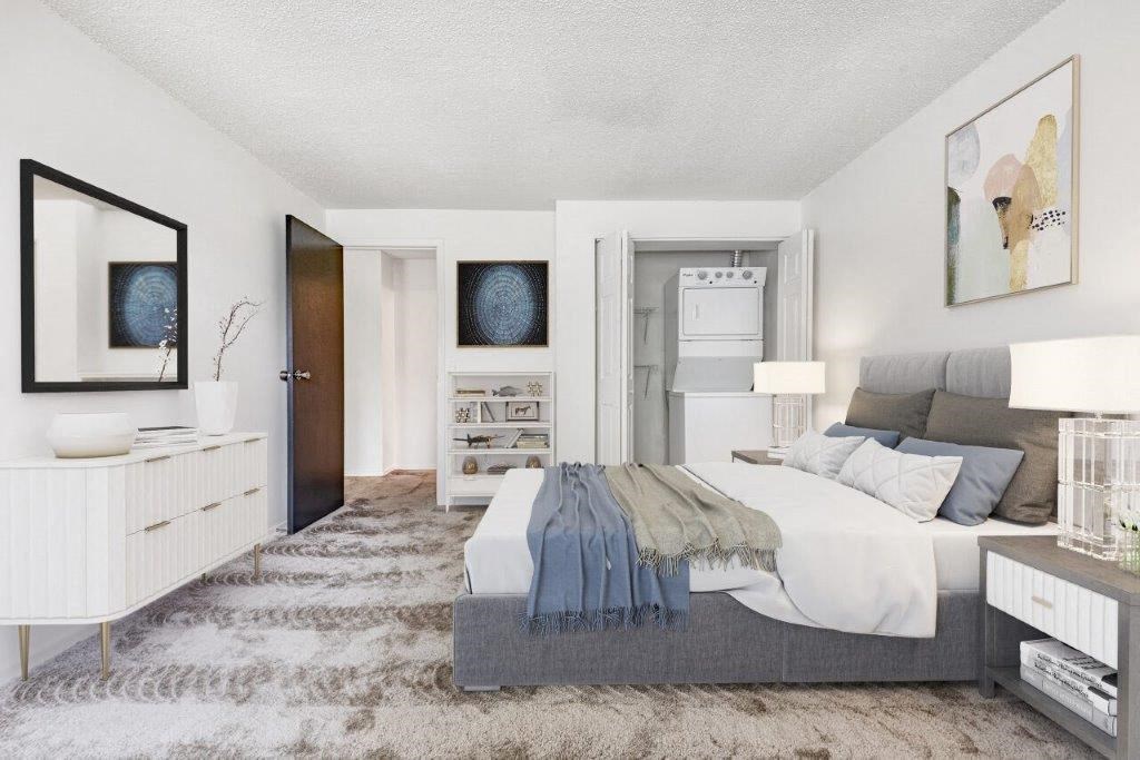 a bedroom with a bed and a dresser