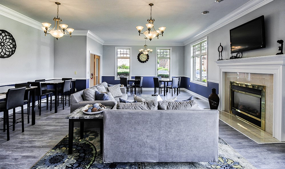 a living room with a couch and a fireplace