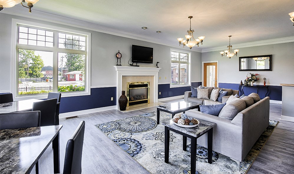 a living room with a fireplace and a couch