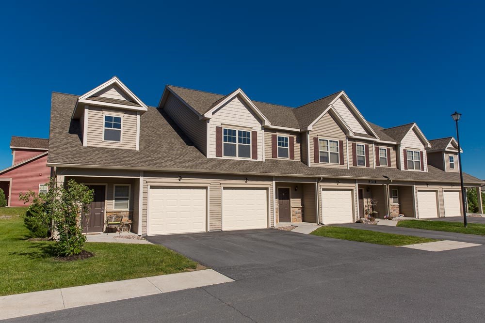 a large house with a street in front of it