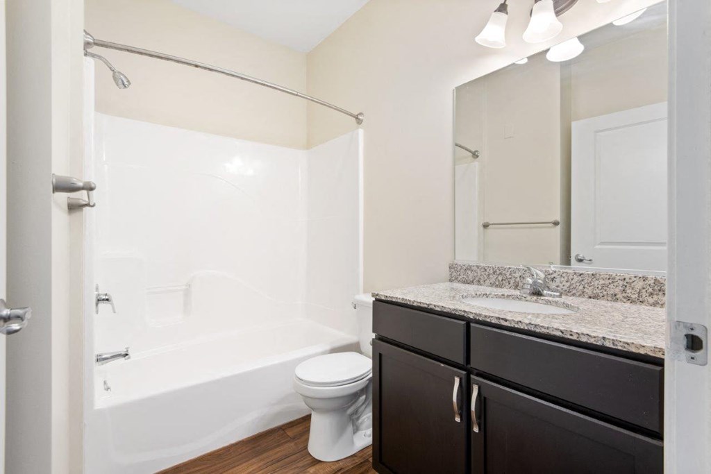 a bathroom with a sink toilet and a shower