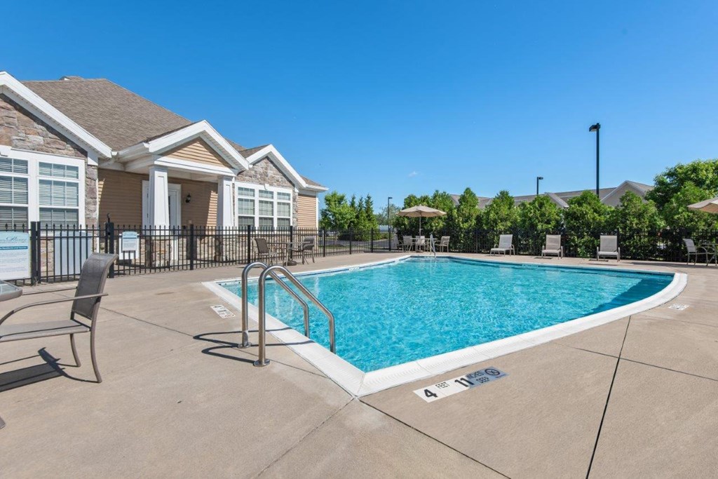 the swimming pool at the estates apartments