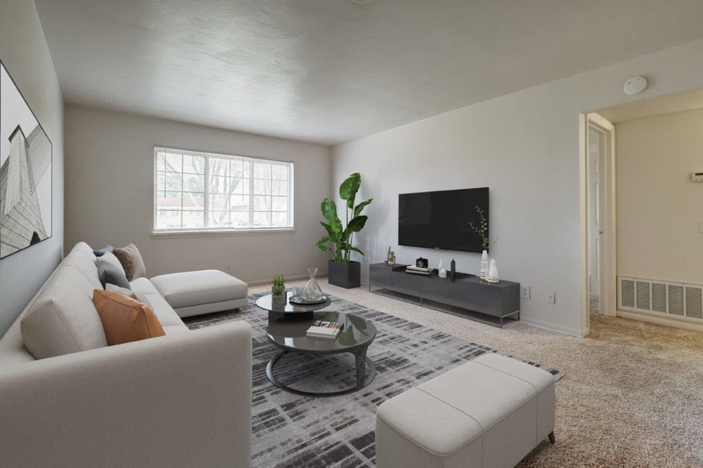 a living room with a couch and a tv