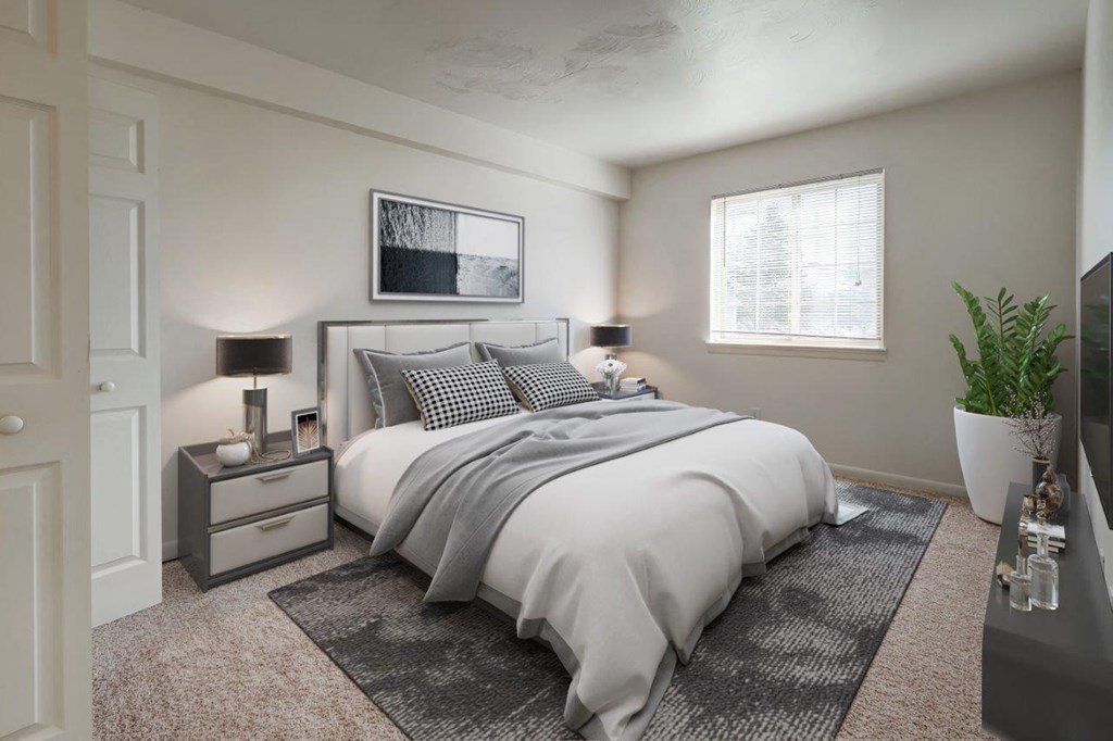 a bedroom with a bed and a window