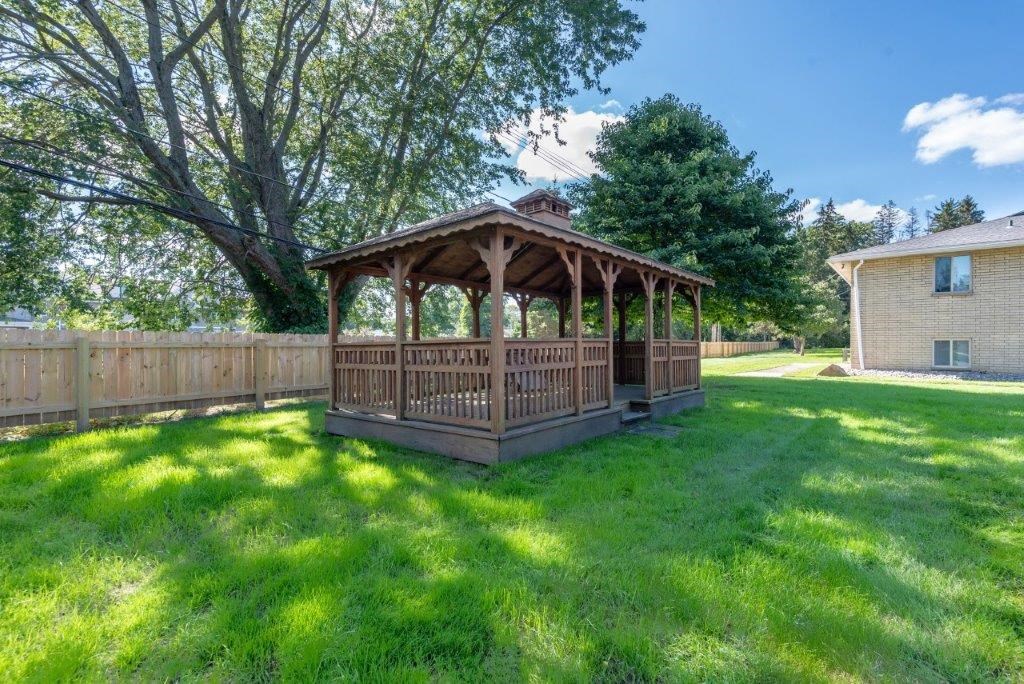 a gazebo in the middle of a yard
