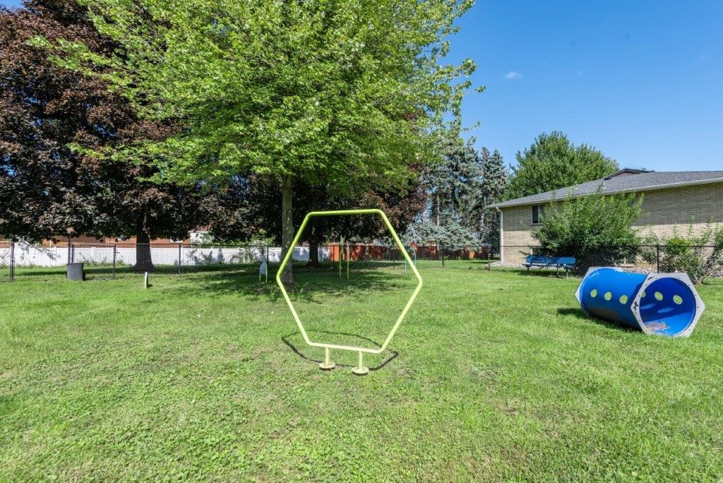 a swing set in the backyard of a house