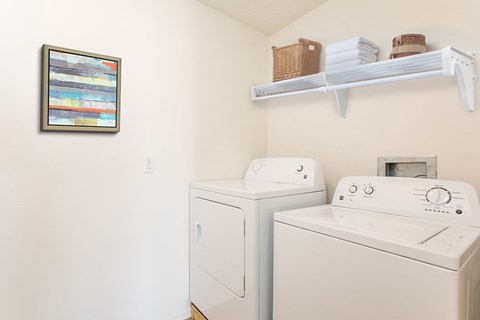 A laundry room with a washer and dryer.