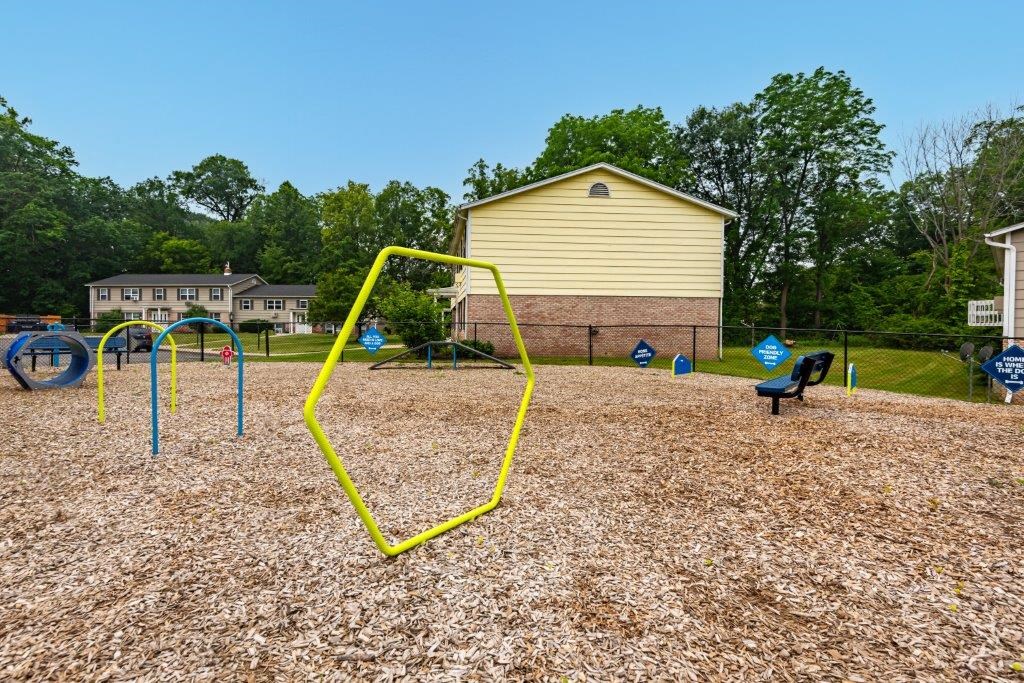 a swing set at a playground in a park