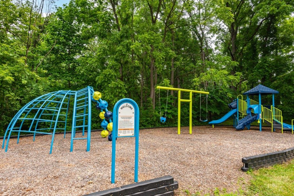 a playground with a slide and other playground equipment