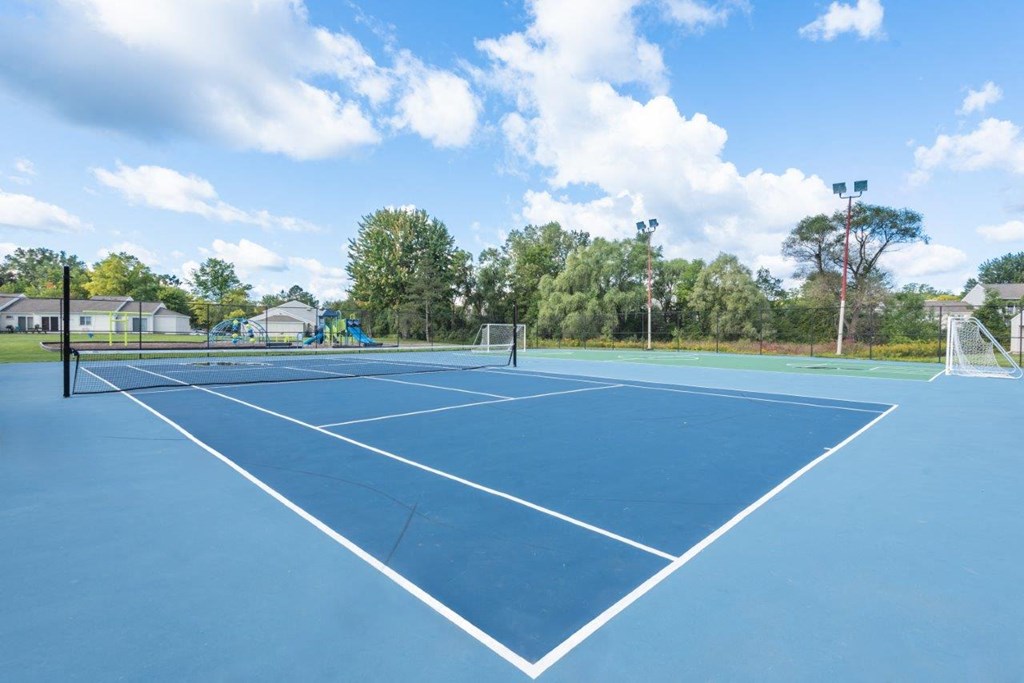 the tennis court is equipped with the latest amenities