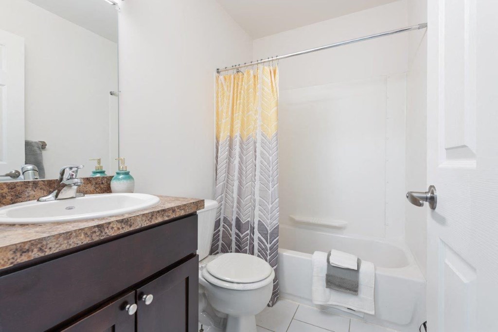 a bathroom with a sink toilet and a shower