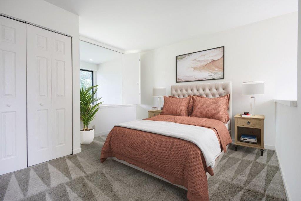 lofted bedroom with carpeting