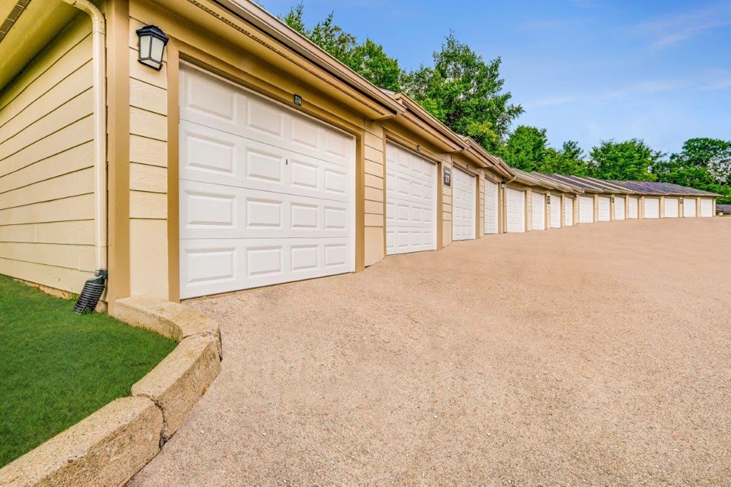 a row of garage doors on the side of a house