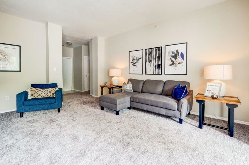 a living room with a couch and a chair