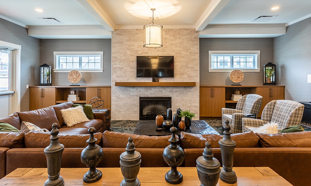 a living room with couches and a fireplace