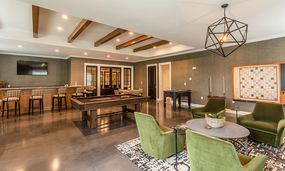 a game room with a pool table and a billiards table