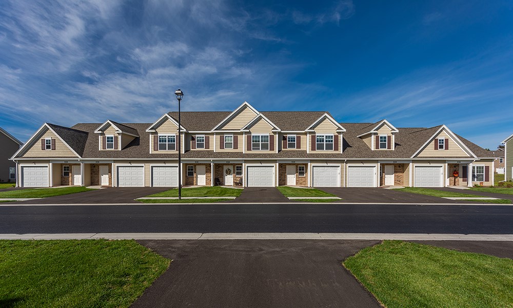 a large house with a street in front of it