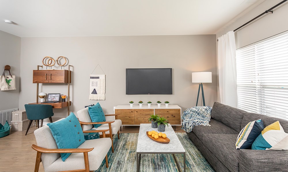 a living room with a couch and a tv