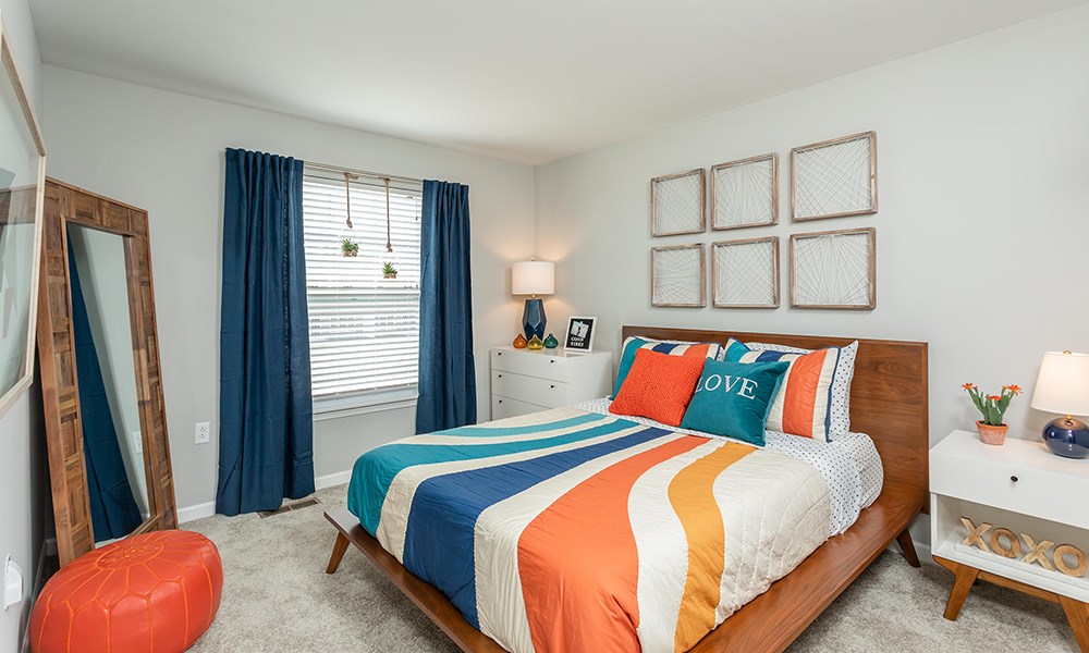 the choices apartments bedroom with bed and dresser and window