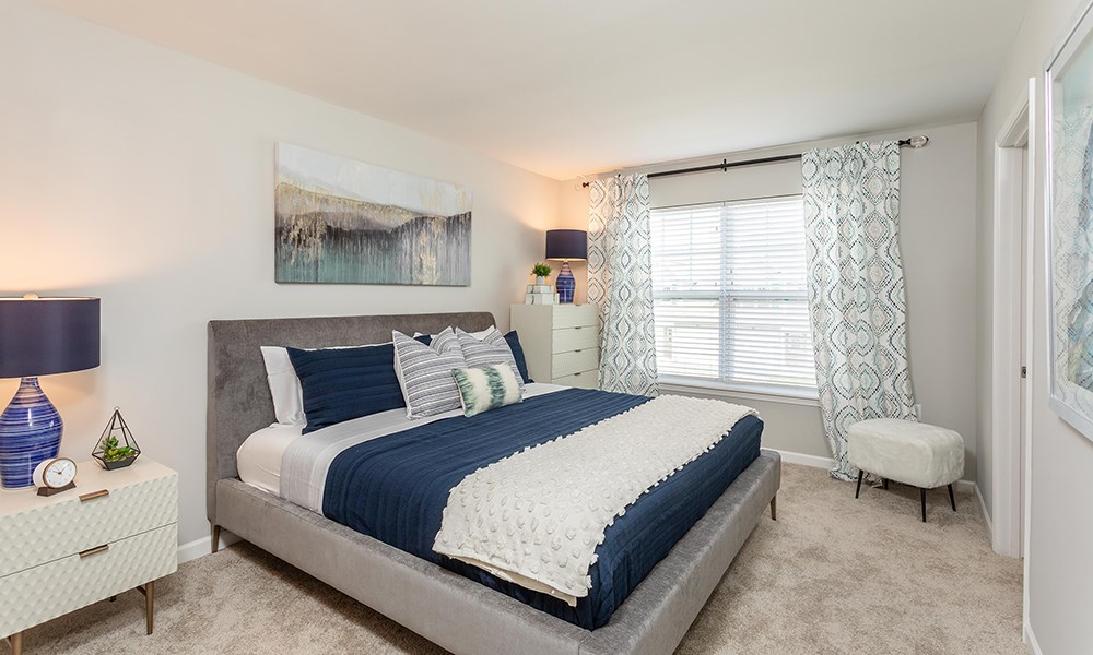 an example of a bedroom with a bed and a window